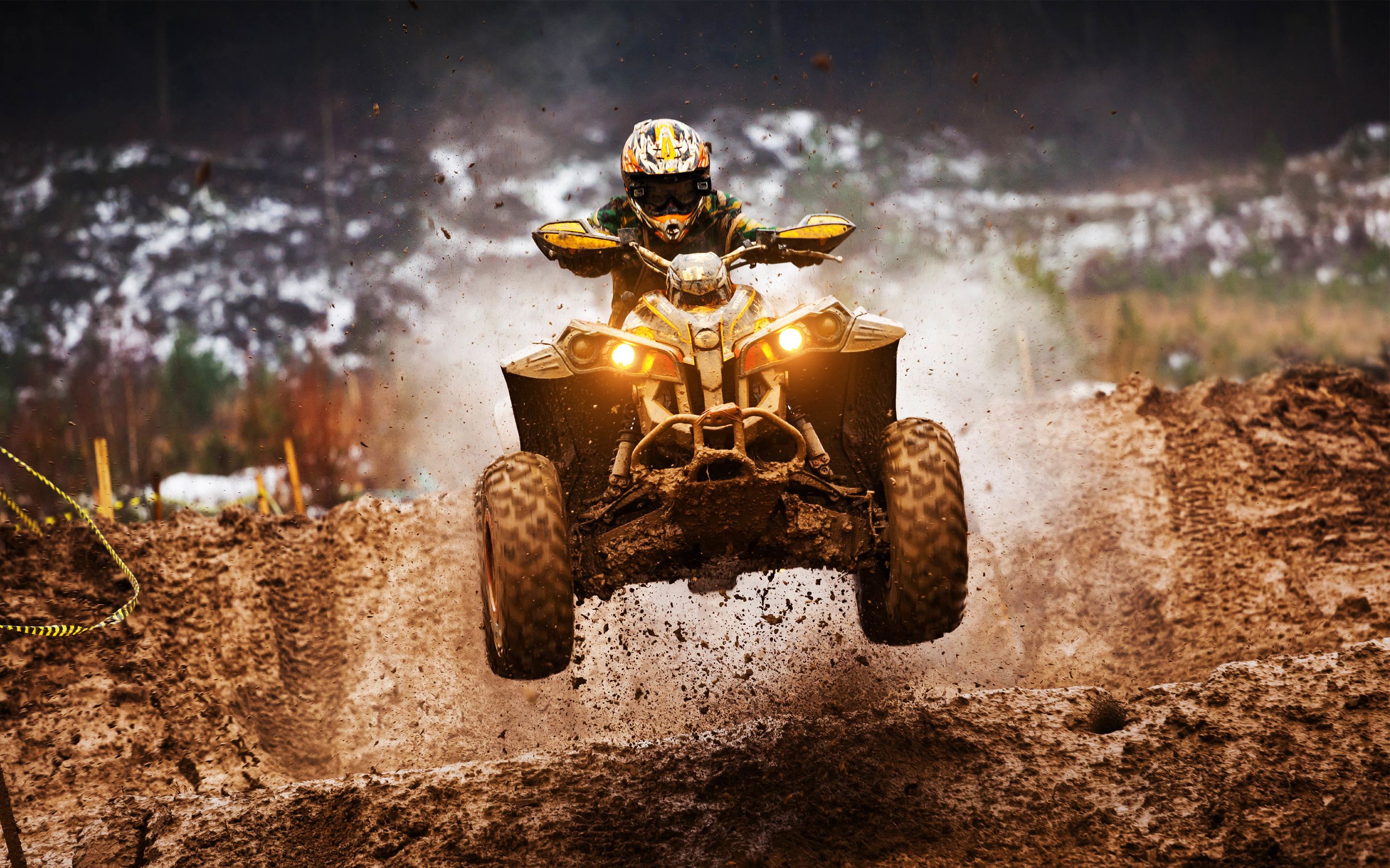 A person riding a dirt bike on a track.