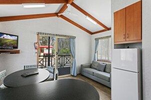 Wattle 2 Bedroom Cabin | Living area | Flat-screen TV