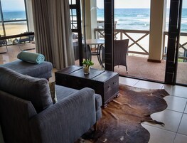 Deluxe Room, 1 Bedroom, Ocean View, Oceanfront | Living area | 32-inch LCD TV with satellite channels, TV