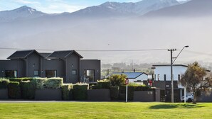 A modern two-story building with a flat roof, a visible front entrance, and a sign indicating a motel. - Kaikoura Gateway Motor Lodge (Kaikoura)