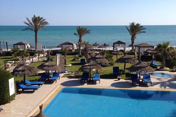 Outdoor pool, open 8 AM to 7 PM, pool umbrellas, sun loungers