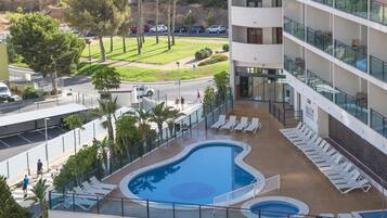 Seasonal outdoor pool, pool loungers