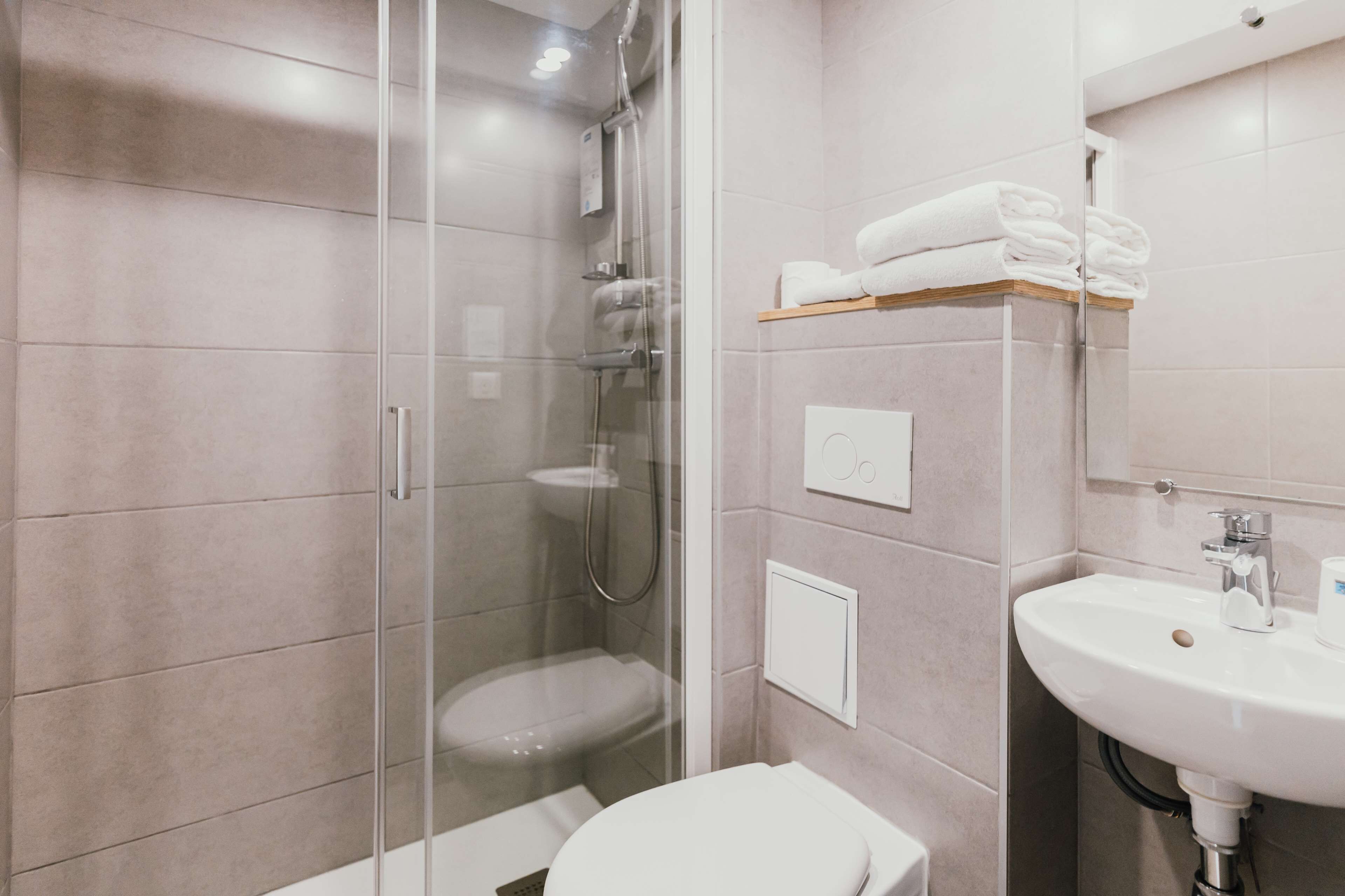 Shower, eco-friendly toiletries, hair dryer, towels