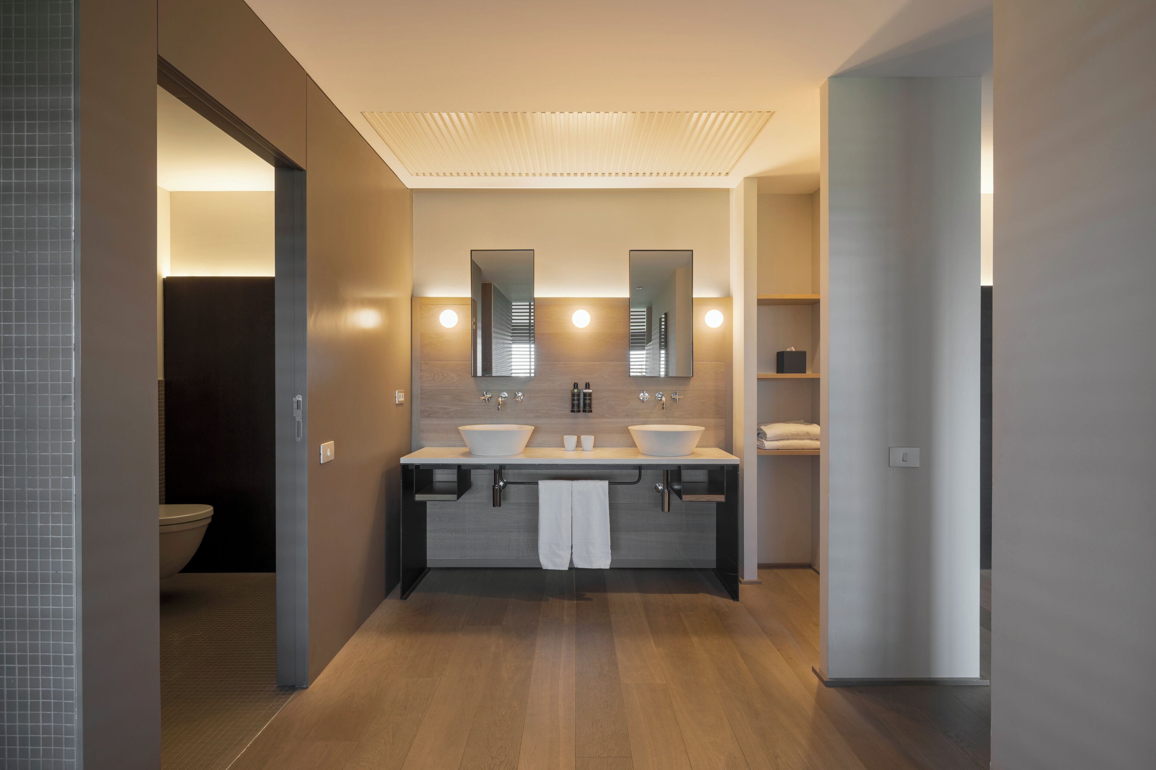 separate bathtub and shower, rainfall showerhead, designer toiletries