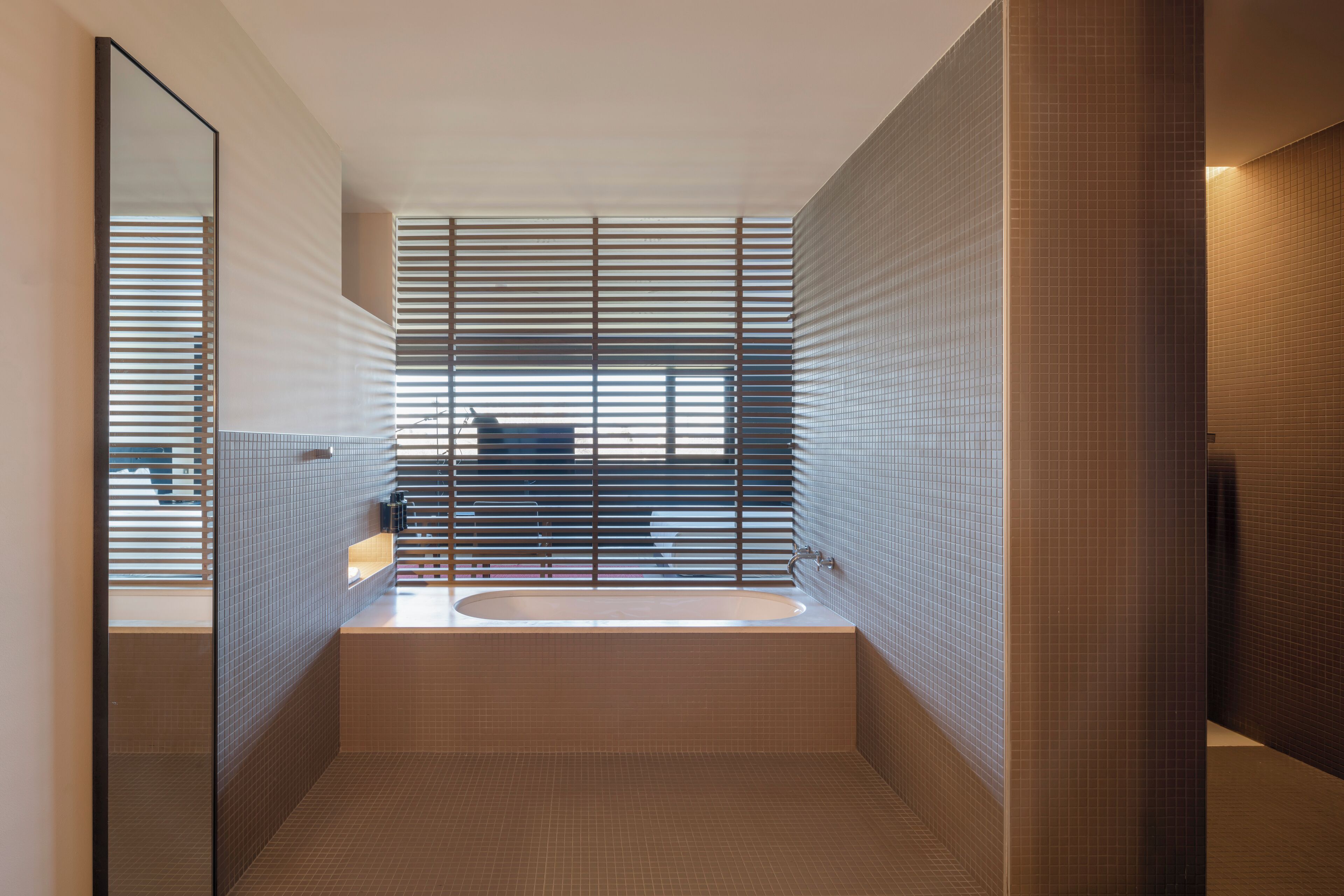 separate bathtub and shower, rainfall showerhead, designer toiletries