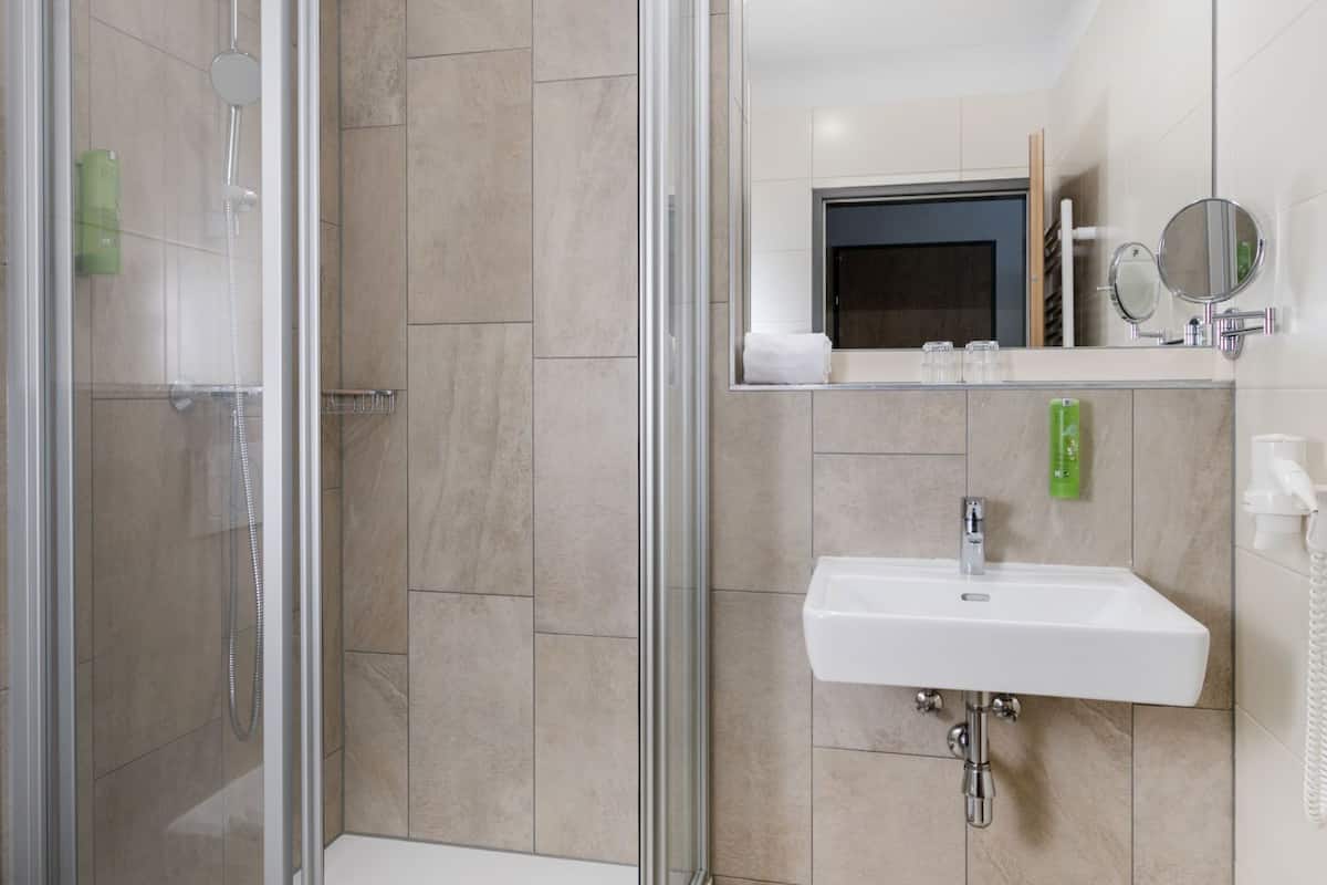 family suite | bathroom | shower, hair dryer, towels