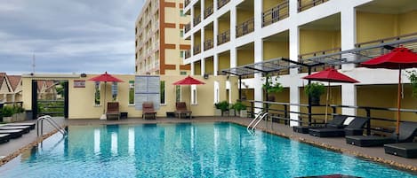 Outdoor pool, open 9 AM to 8 PM, pool umbrellas, pool loungers