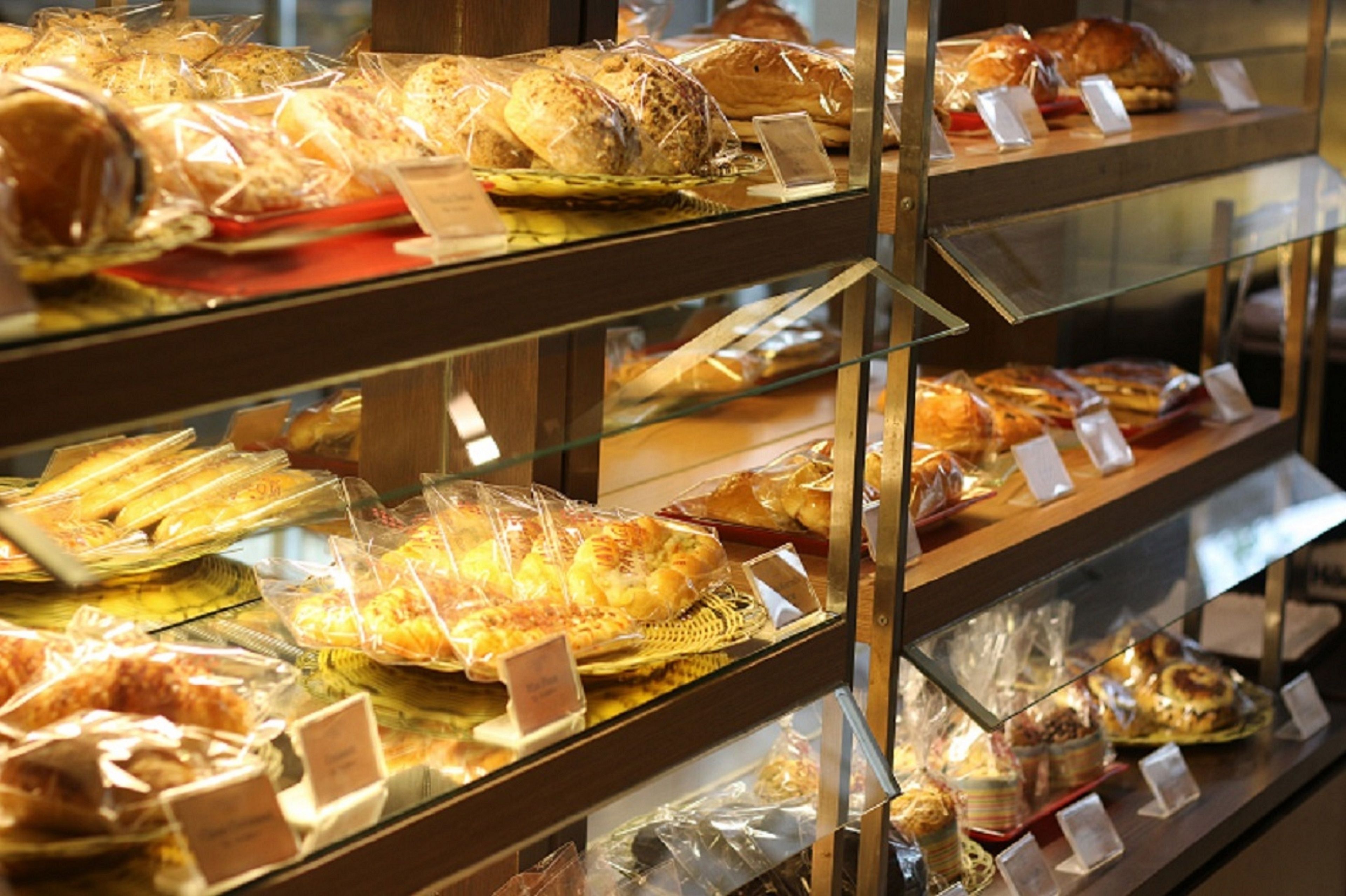 A bakery display case with various baked goods.