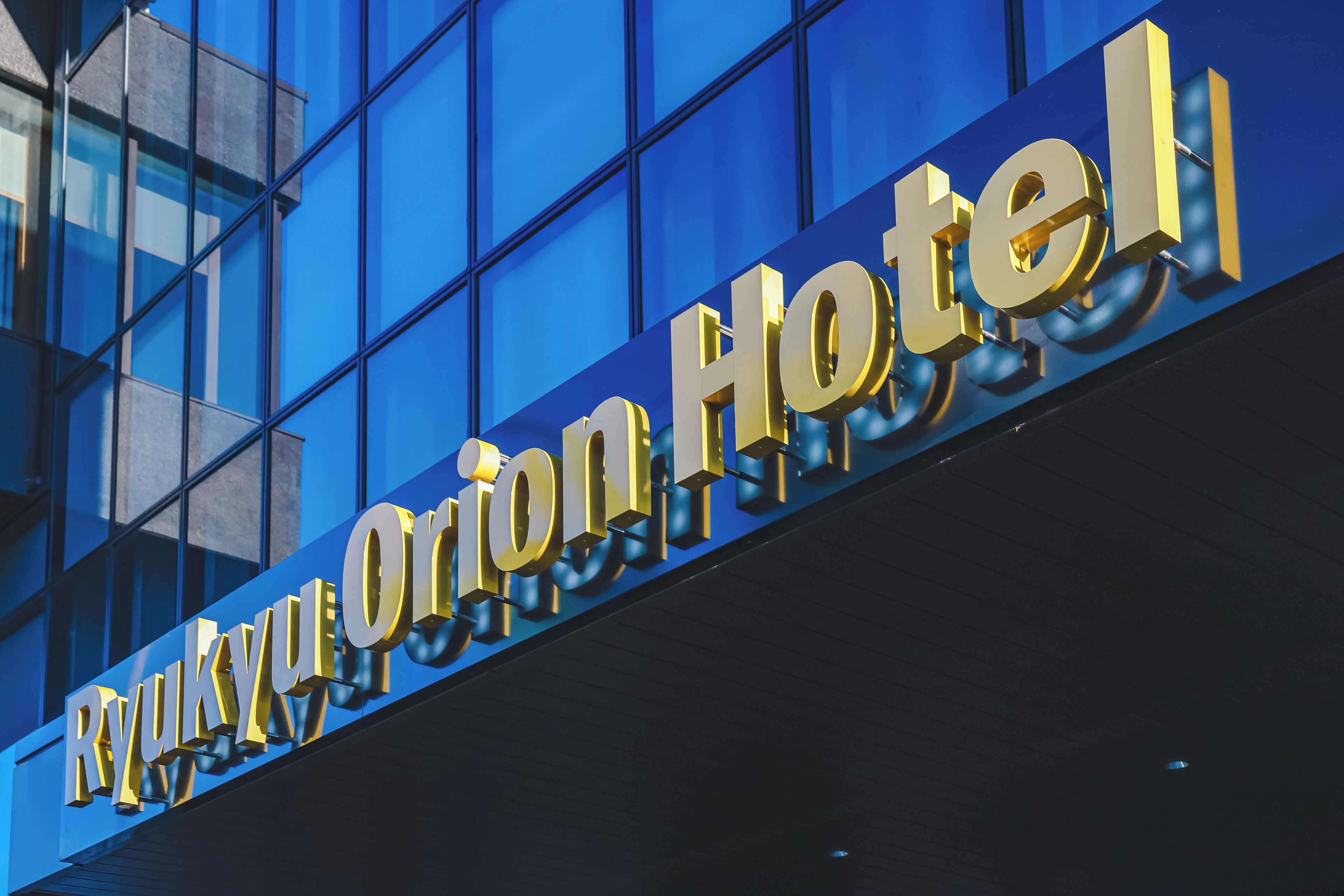 A hotel sign with the name 'Rivoli Hotel' in large, bold letters.