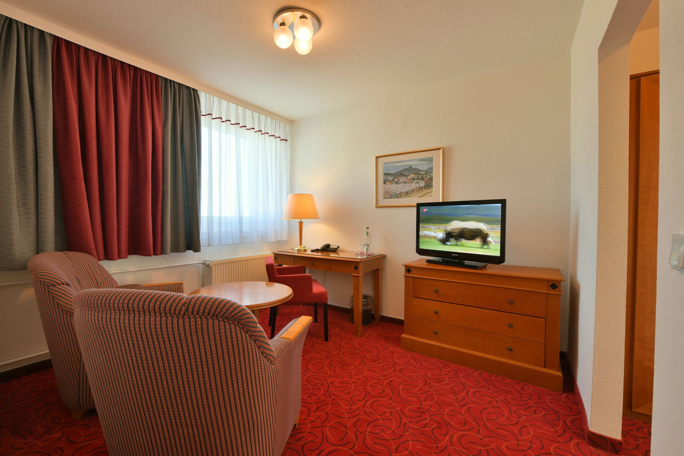 standard room | living area | flat-screen tv