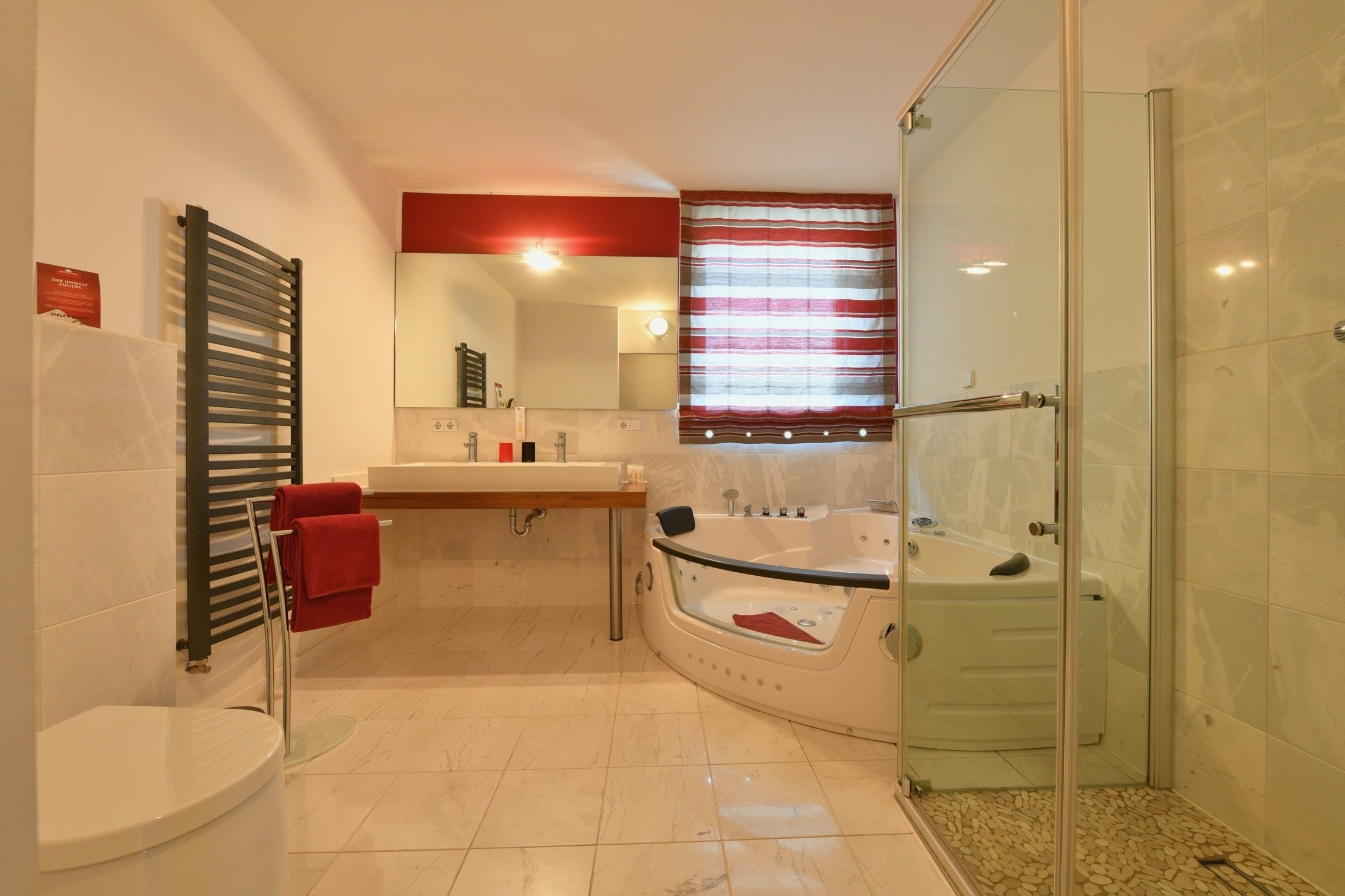 junior suite | bathroom | shower, free toiletries, hair dryer, towels