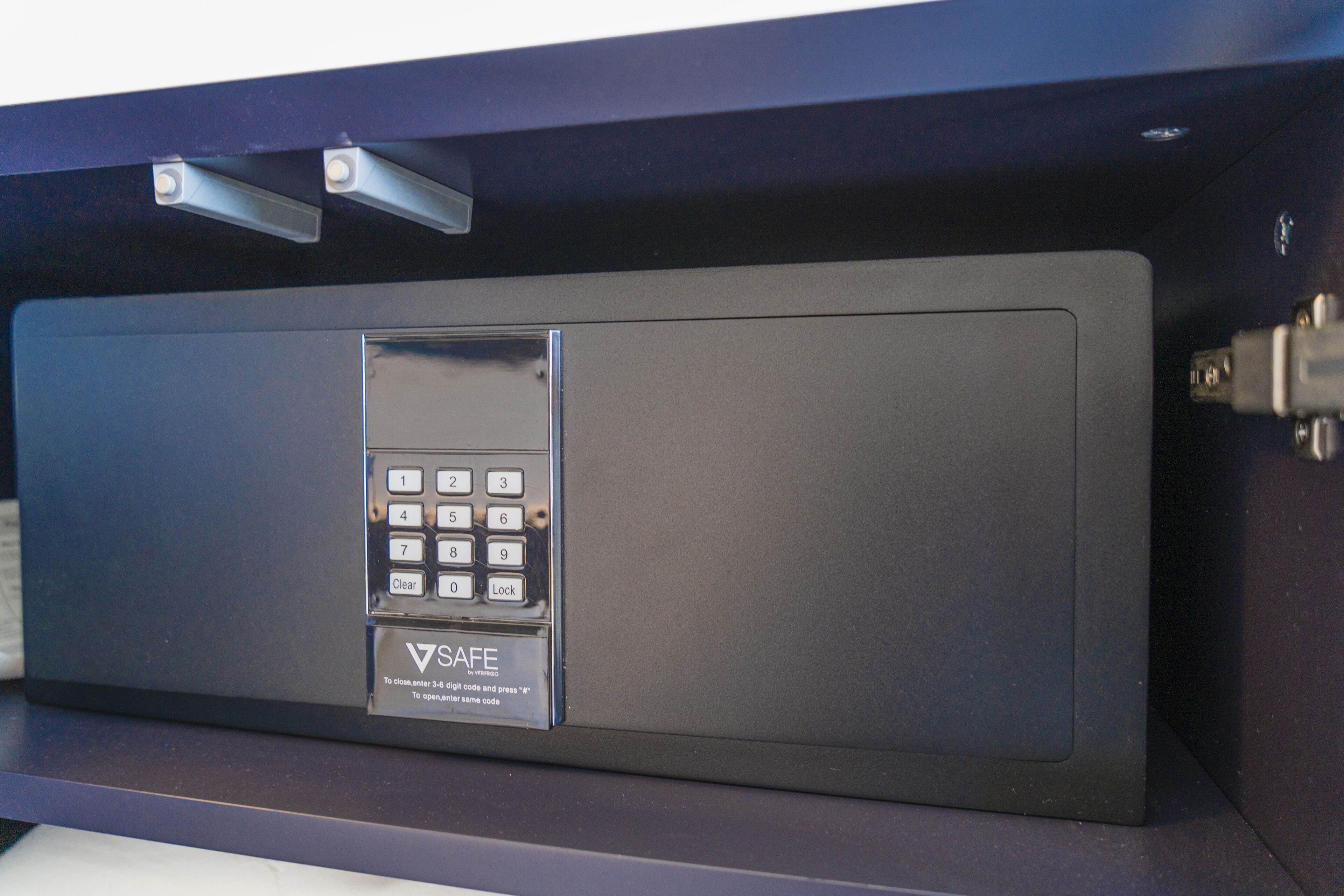 A safe with a keypad and a clear instruction label.