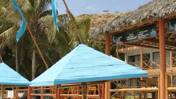 On the beach, sun loungers, beach towels, snorkeling