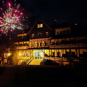 A hotel with a traditional European architectural style, featuring a prominent entrance with a staircase leading to the main door. - KURHOTEL Bad Suderode (Quedlinburg)