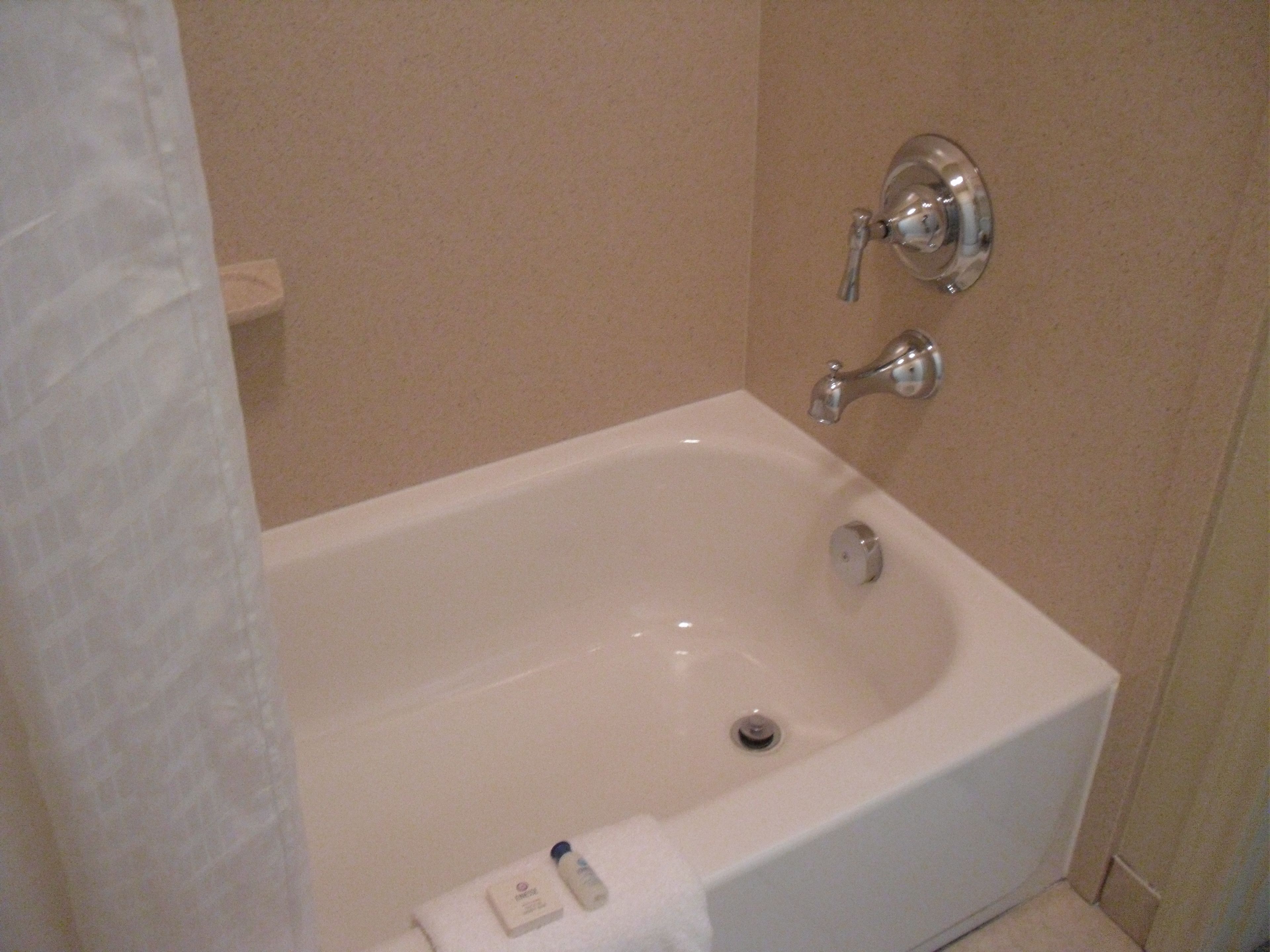 combined shower/bathtub, free toiletries, hair dryer, towels