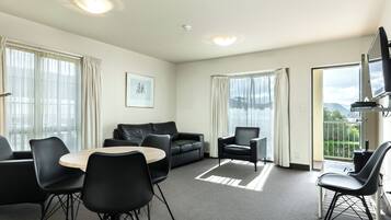 Luxury Apartment, 2 Queen Beds, Partial Ocean View | Living area | 43-inch Smart TV with digital channels, TV