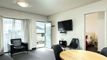 Luxury Apartment, 2 Queen Beds, Partial Ocean View | Living area | 43-inch Smart TV with digital channels, TV