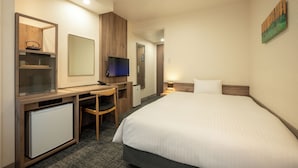 A hotel room with a bed, a desk with a computer, a television, and a small refrigerator. - Sendai Garden Palace (Sendai)