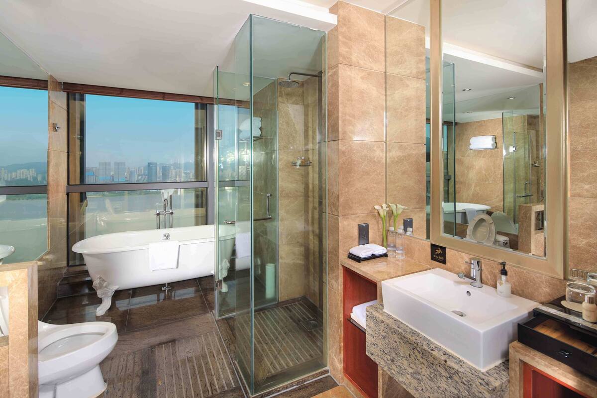 separate bathtub and shower, deep-soaking bathtub, rainfall showerhead