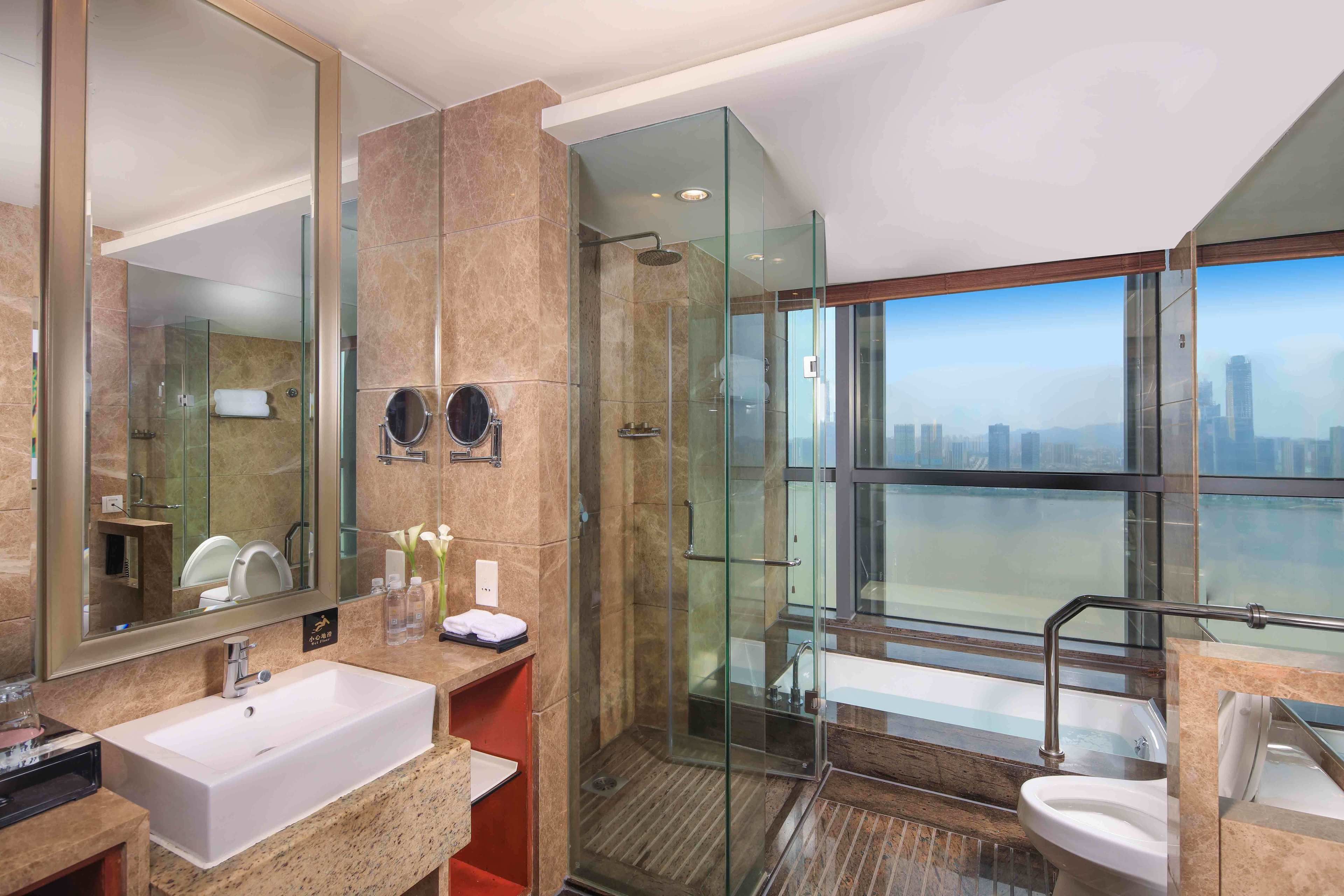 separate bathtub and shower, deep-soaking bathtub, rainfall showerhead