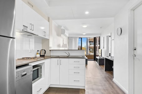 Fridge, microwave, stovetop, dishwasher. Dolphin Quay Apartments
