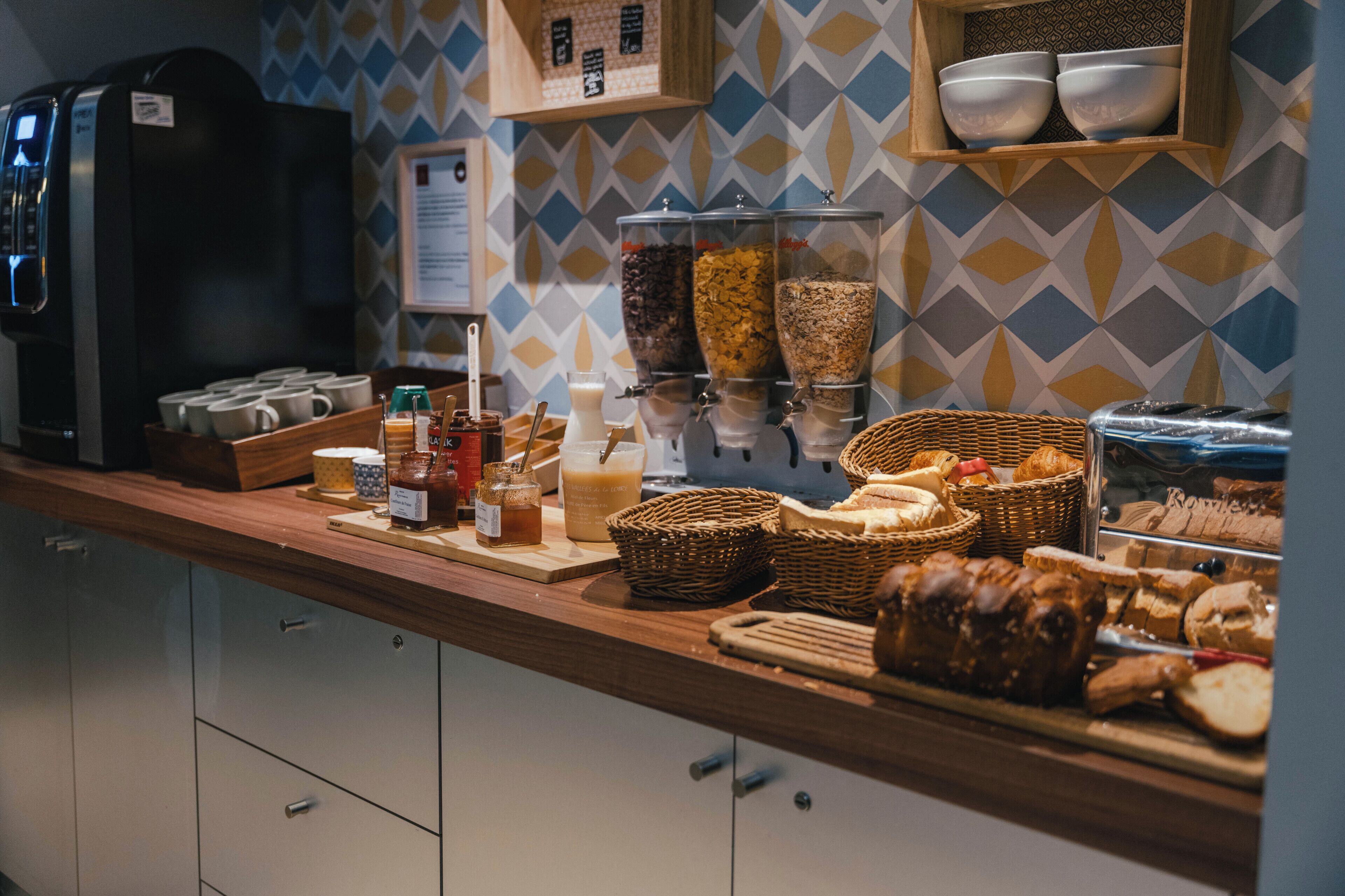 A breakfast buffet with various food items and condiments.
