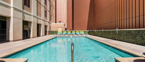 Outdoor pool, open 9:00 AM to 8:00 PM, pool umbrellas, pool loungers