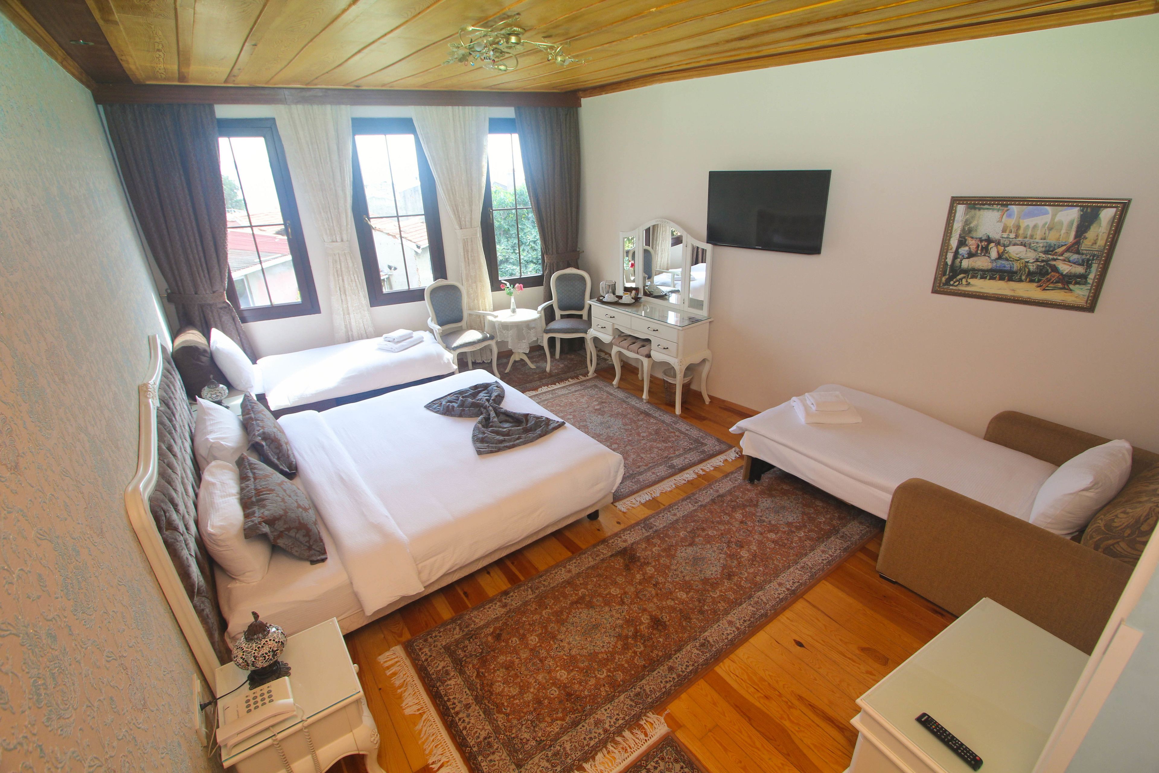 family room | premium bedding, down duvets, minibar, in-room safe