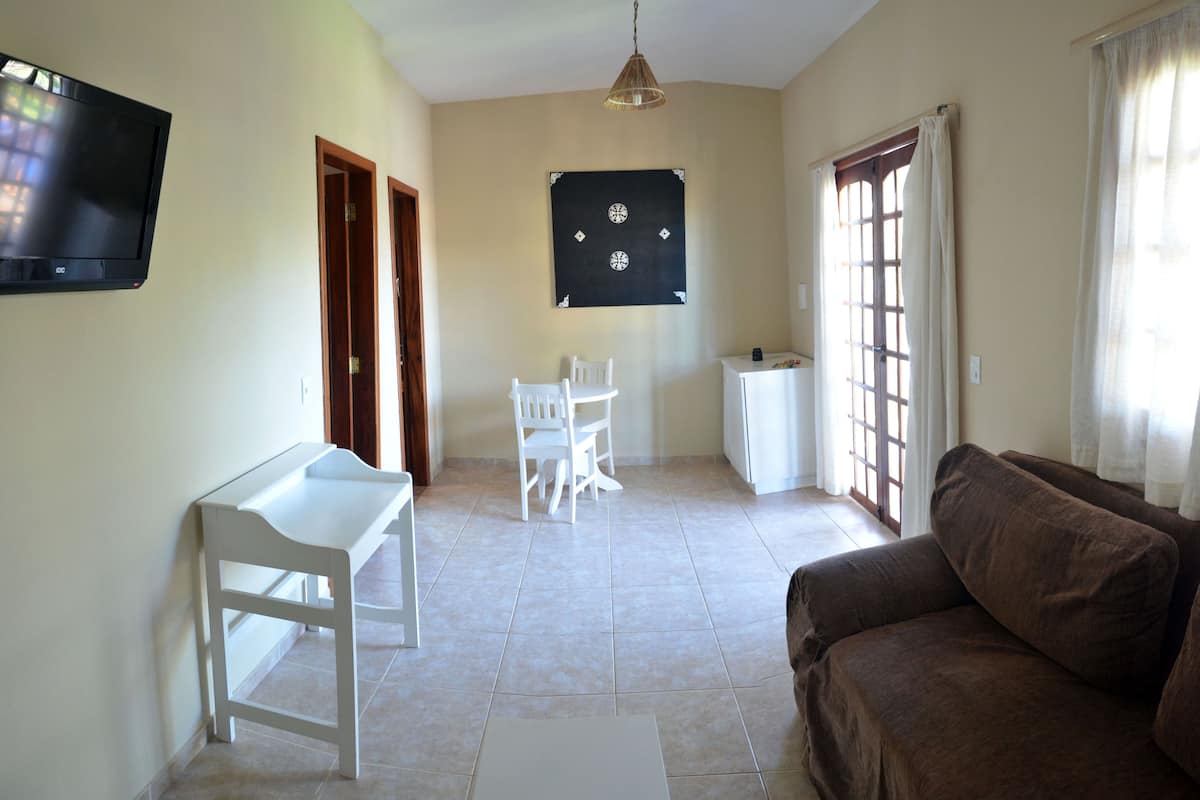 deluxe apartment, pool view | 1 bedroom, in-room safe, desk, laptop workspace