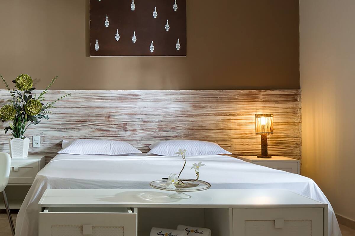 deluxe apartment, pool view | 1 bedroom, in-room safe, desk, laptop workspace