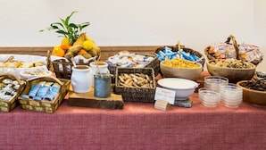 A buffet table with various food items and condiments. - La Barme (Cogne)