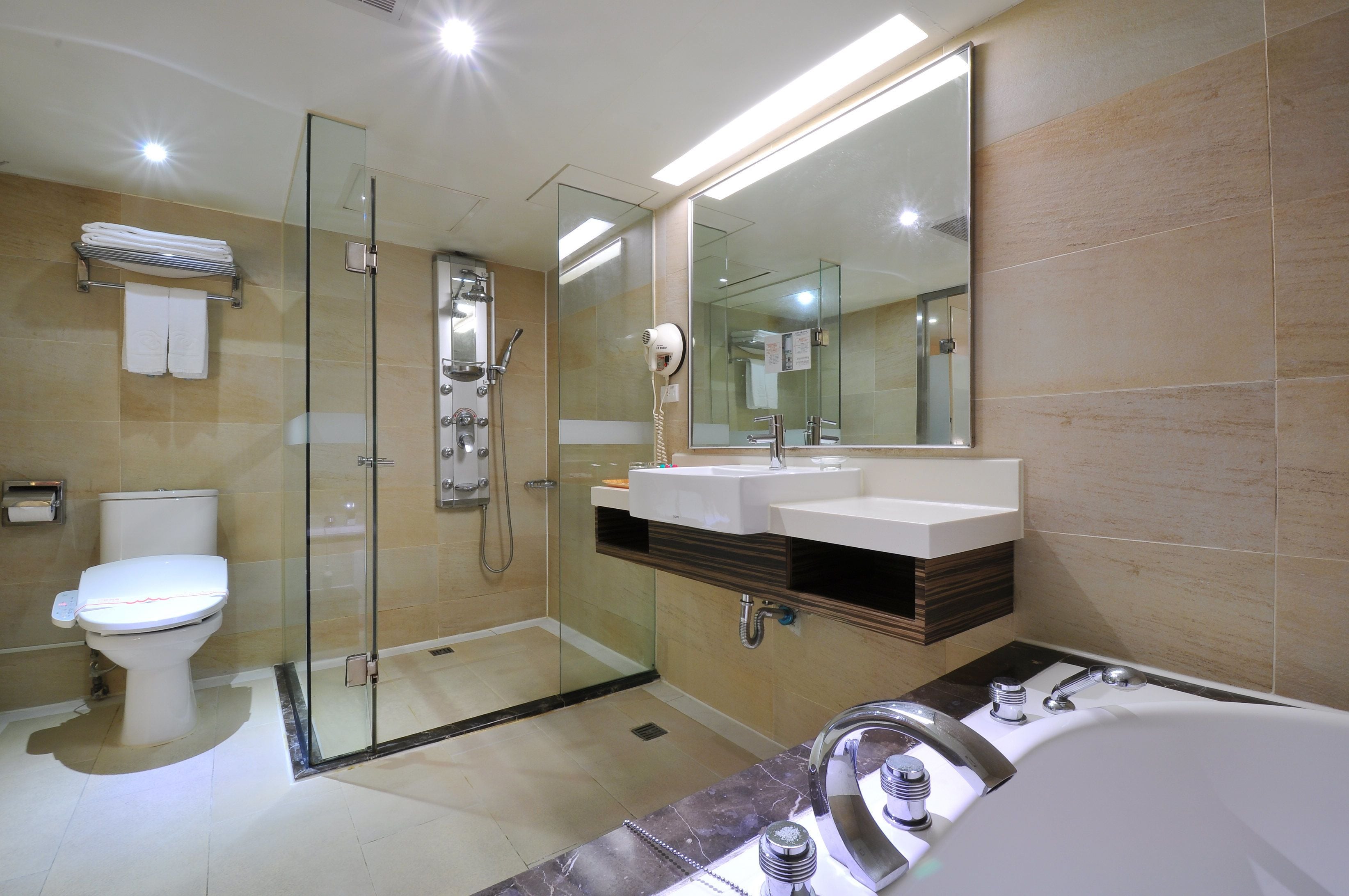 deluxe twin room, 2 double beds | bathroom | shower, free toiletries, hair dryer, slippers