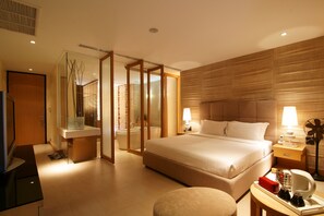 Deluxe Room, Partial Sea View | Premium bedding, in-room safe, desk, blackout drapes