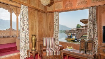 Suite, 1 Queen Bed | Living room | Flat-screen TV