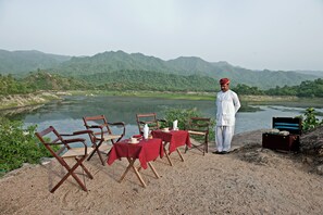 2 restaurants; breakfast, lunch, and dinner served - WelcomHeritage Maharani Bagh Orchard Retreat (Desuri)