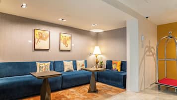 Relax in style with a plush sofa, decorative pillows, and a cozy reading nook.