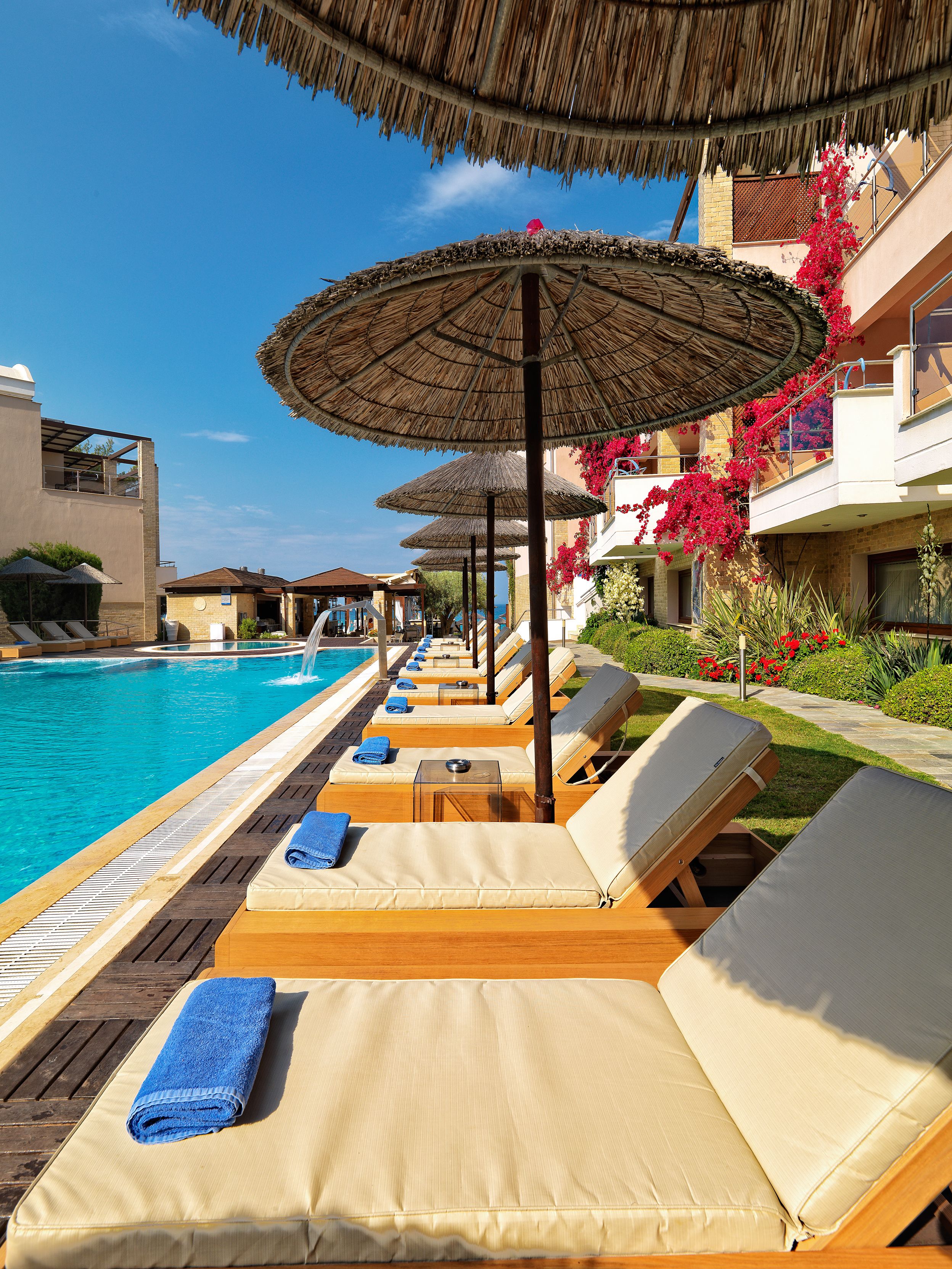 seasonal outdoor pool, pool umbrellas, pool loungers