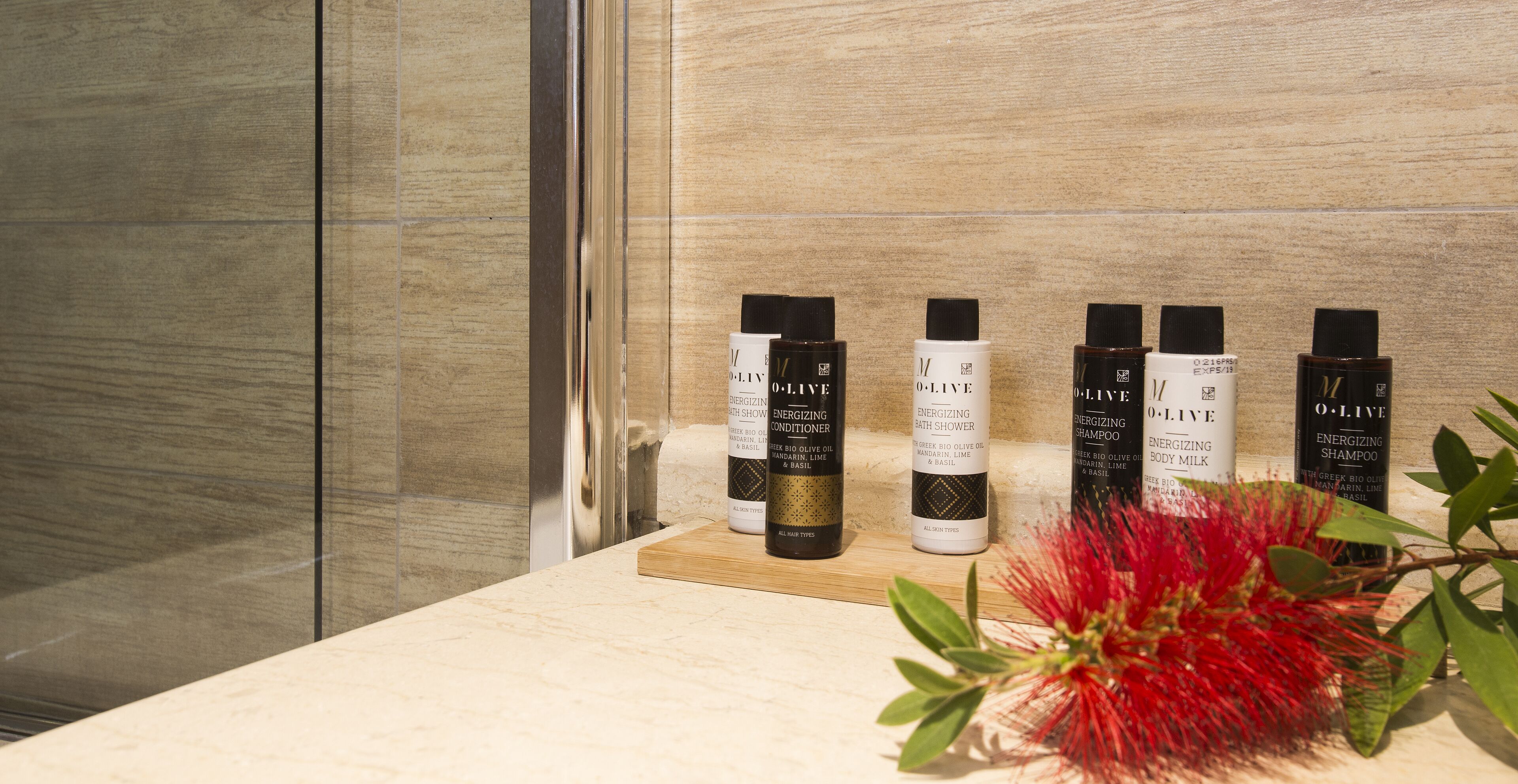 designer toiletries, hair dryer, bathrobes, slippers