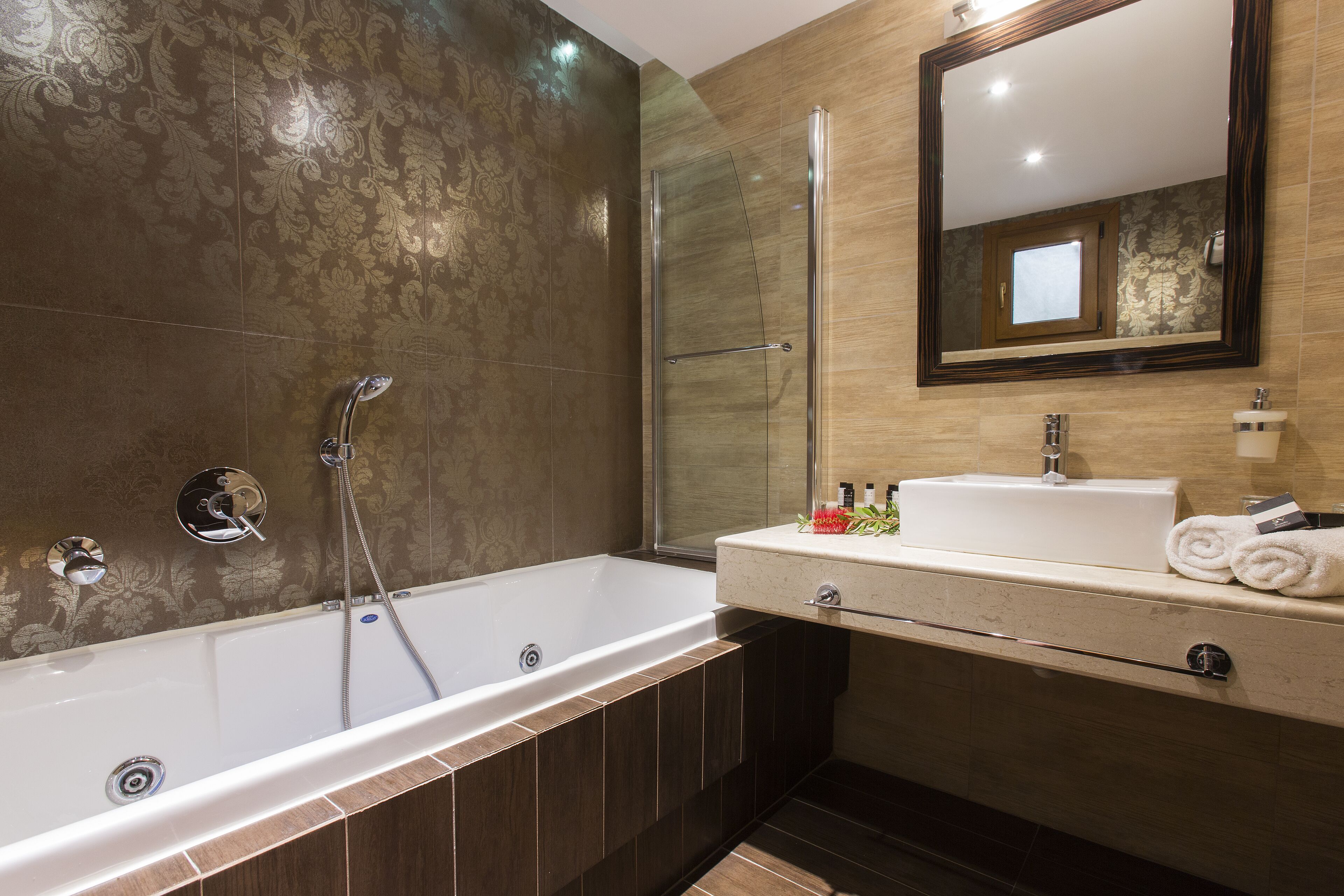 designer toiletries, hair dryer, bathrobes, slippers