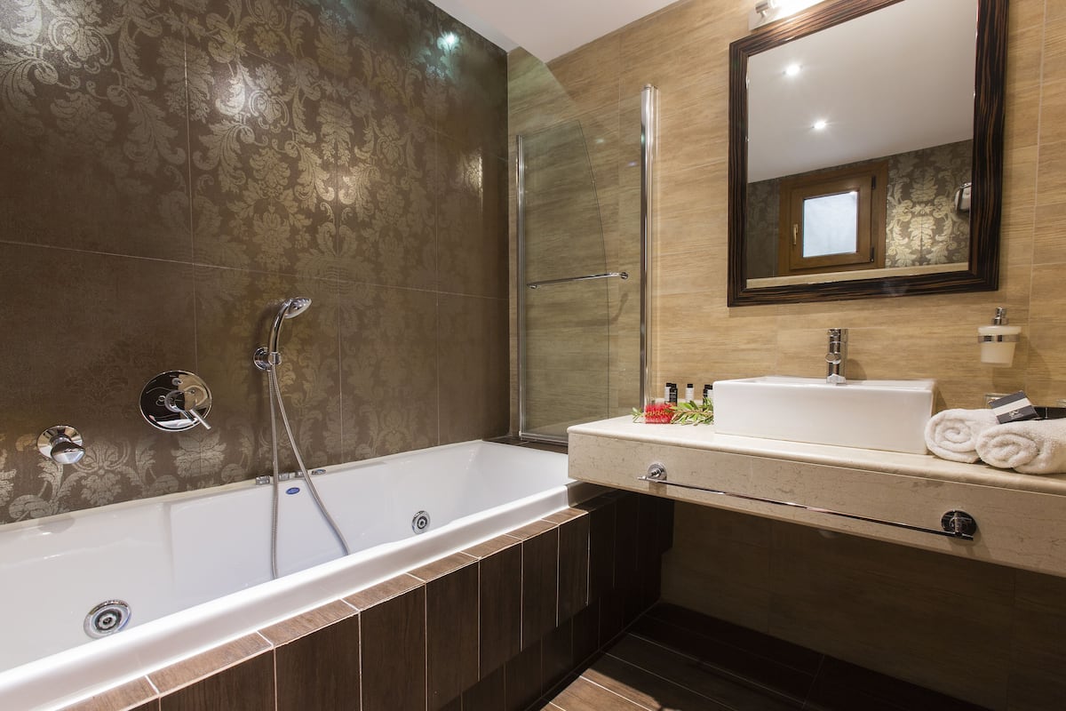 designer toiletries, hair dryer, bathrobes, slippers