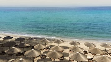 On the beach, sun loungers, beach umbrellas, beach towels