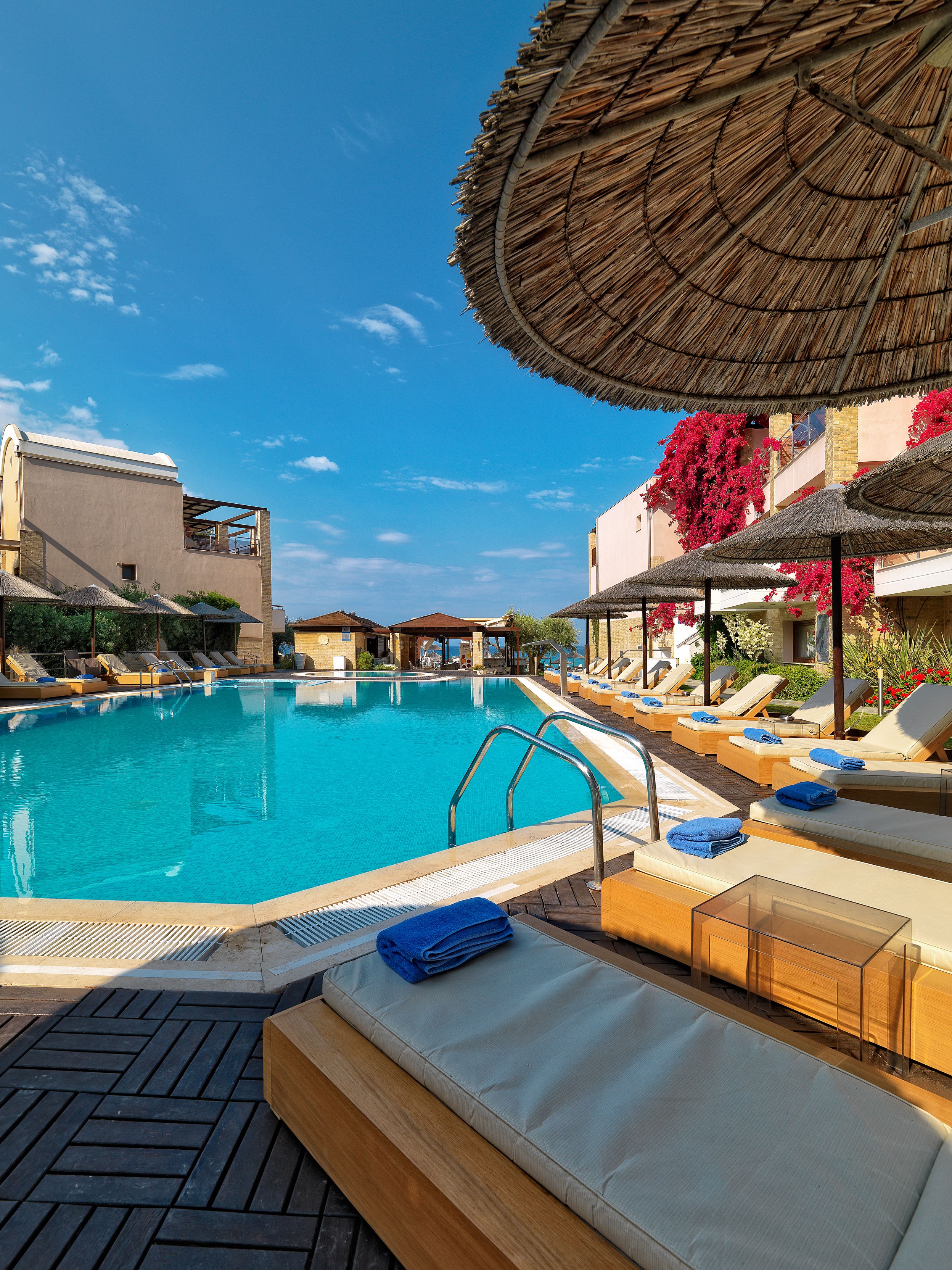 seasonal outdoor pool, pool umbrellas, pool loungers