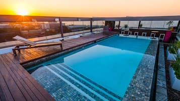 Outdoor pool, pool umbrellas, sun loungers