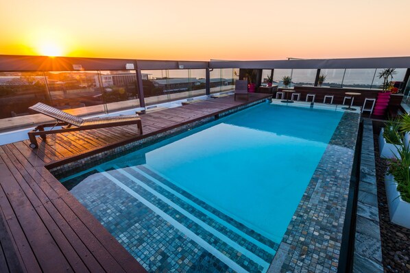Outdoor pool, pool umbrellas, pool loungers