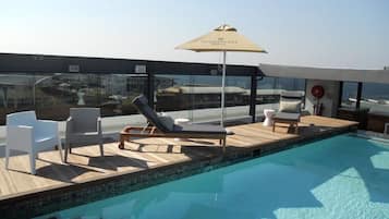 Outdoor pool, pool umbrellas, pool loungers