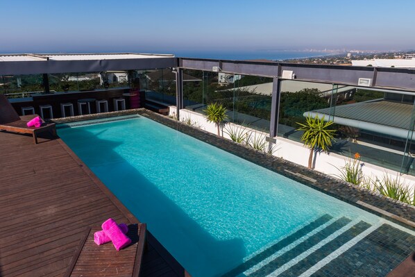 Outdoor pool, pool umbrellas, pool loungers