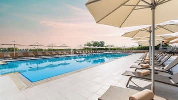 Outdoor pool, open 6:00 AM to 8:00 PM, pool umbrellas, pool loungers