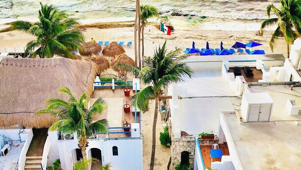 A beachfront hotel with multiple rooms, a beach area with umbrellas, and a clear view of the ocean. - Pelicano Inn Playa del Carmen - Beachfront Hotel (Playa del Carmen)