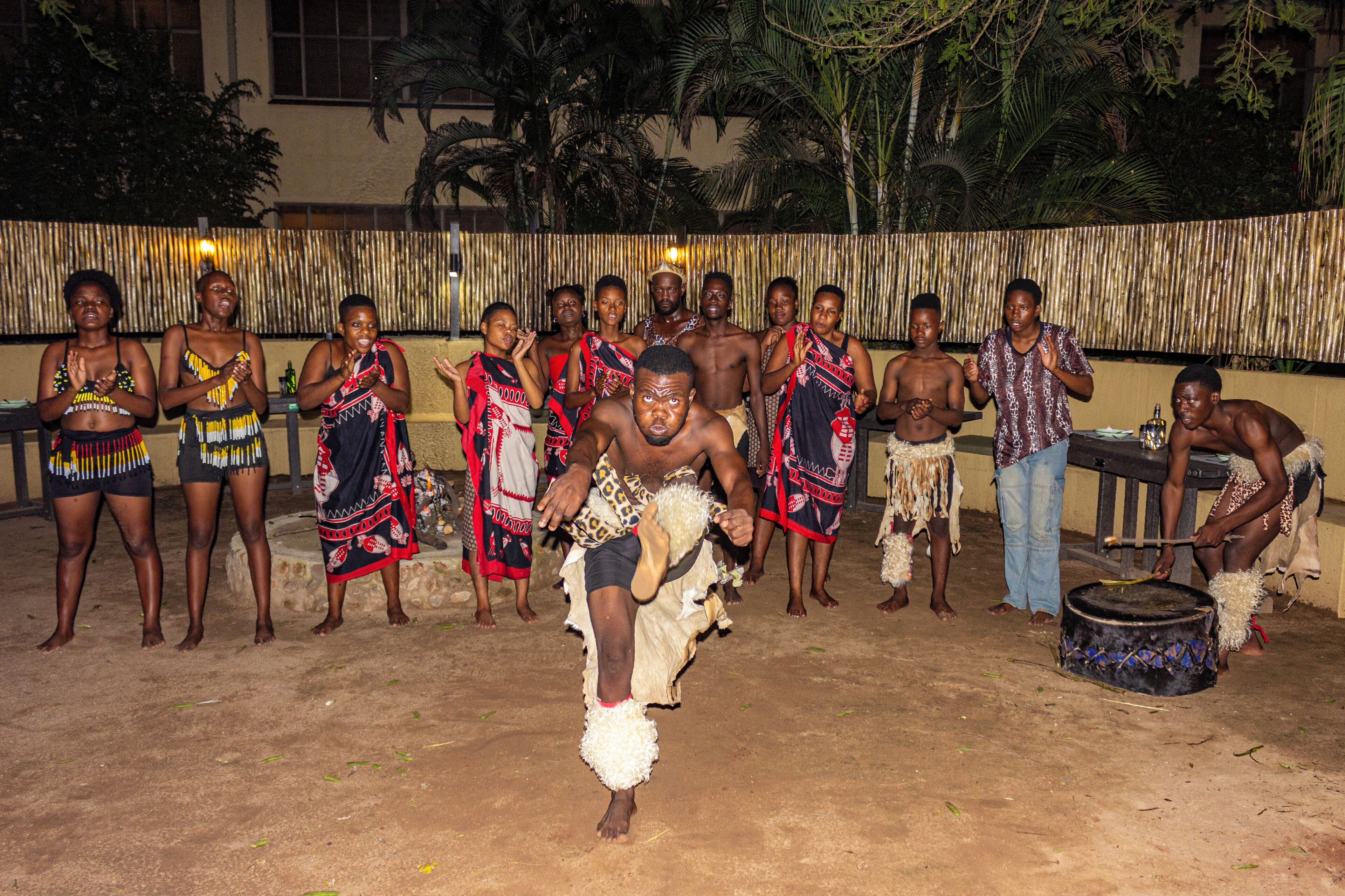 A group of people in traditional attire performing a dance.