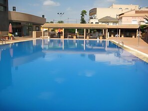 Seasonal outdoor pool, a waterfall pool, sun loungers
